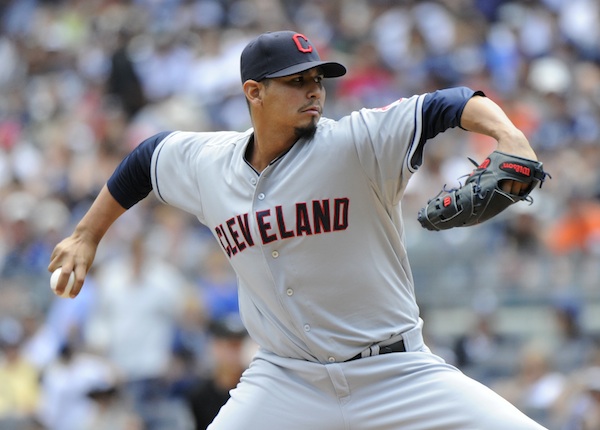 Cleveland Indians pitcher Carlos Carrasco delivers the ball to the New York Yankees during the first inning of a baseball game Sunday, Aug. 10, 2014, at Yankee Stadium in New York. (AP Photo/Bill Kostroun)
